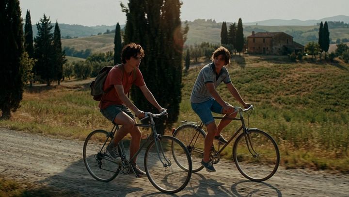 The same shot of two cyclists, graded by AI Color Match to the Blue Moon Miami look