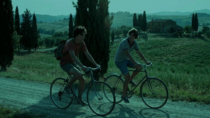 The same shot of two cyclists, graded by AI Color Match to the Silent Vampire look